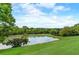 Serene pond with lush green surroundings at 141 Maison Nw Pl, Atlanta, GA 30327