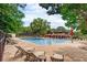 Community pool with plenty of lounge chairs at 141 Maison Nw Pl, Atlanta, GA 30327