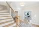 Bright entryway with staircase and view of office at 4657 Jefferson Township Ln, Marietta, GA 30066