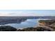 Beautiful aerial view of lake and surrounding mature trees at 4847 Lakewood Dr, Acworth, GA 30101
