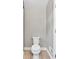 Bathroom with travertine floors, white toilet, and modern neutral colored paint at 4847 Lakewood Dr, Acworth, GA 30101