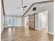 Main bedroom with beamed ceilings, hardwood floors, barn door and lots of natural light at 4847 Lakewood Dr, Acworth, GA 30101