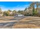 Detached garage with large driveway and mature trees at 4847 Lakewood Dr, Acworth, GA 30101