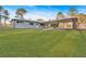 Single story home with a porte-cochere, and a lush green lawn at 4847 Lakewood Dr, Acworth, GA 30101