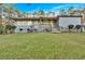 Beautiful front yard with a landscaped lawn, a view of the porch, stairs, and front door at 4847 Lakewood Dr, Acworth, GA 30101