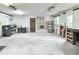 Spacious garage with bright lighting, shelving, and large windows at 4847 Lakewood Dr, Acworth, GA 30101