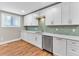 Modern kitchen featuring white cabinets and stainless steel appliances at 4847 Lakewood Dr, Acworth, GA 30101