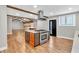 Spacious open kitchen featuring a large kitchen island with a cooktop and hardwood floors at 4847 Lakewood Dr, Acworth, GA 30101