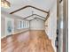 Open-concept living space featuring hardwood floors and wooden beam accents at 4847 Lakewood Dr, Acworth, GA 30101