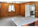 Office area with wood paneling, bright lighting, and large window at 4847 Lakewood Dr, Acworth, GA 30101