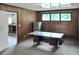Office area with wood paneling, large window, and room for storage at 4847 Lakewood Dr, Acworth, GA 30101