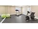 Well-equipped exercise room featuring treadmill, stationary bike, and weights at 820 Hedgegate Ct, Roswell, GA 30075