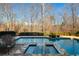 Inviting pool and spa with stone deck at 820 Hedgegate Ct, Roswell, GA 30075