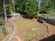 Large backyard with a spacious grassy area and stone pathway at 1046 Ormewood, Atlanta, GA 30316