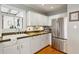 Modern kitchen with stainless steel appliances and white cabinets at 1046 Ormewood, Atlanta, GA 30316