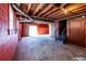 Unfinished basement with concrete floor, exposed beams, and a storage area at 850 Briarwood Trl, Douglasville, GA 30134