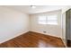 Well-lit bedroom with hardwood floors and a mirrored closet at 850 Briarwood Trl, Douglasville, GA 30134