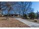 Ranch house with long driveway and mature trees at 850 Briarwood Trl, Douglasville, GA 30134