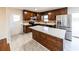 Renovated kitchen with island, stainless steel appliances, and wood cabinets at 850 Briarwood Trl, Douglasville, GA 30134