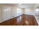 Bright living room featuring hardwood floors and neutral-toned walls at 850 Briarwood Trl, Douglasville, GA 30134