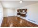 Spacious living room with hardwood floors and an open view into the kitchen at 850 Briarwood Trl, Douglasville, GA 30134