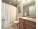 Clean bathroom with shower/tub combo and wood vanity at 95 Stone Commons Way, Covington, GA 30016