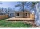 A house with a deck in the backyard and with a privacy fence and with a grass lawn at 1268 Kenilworth Sw Dr, Atlanta, GA 30310