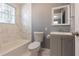 Bathroom featuring a white shower over tub, vanity with storage, and a modern sink at 1268 Kenilworth Sw Dr, Atlanta, GA 30310