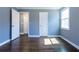 Bedroom with hardwood floors, neutral walls, and a bright window at 1268 Kenilworth Sw Dr, Atlanta, GA 30310