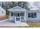 Charming home featuring a covered front porch with a porch swing and beautiful, neutral color palette at 1268 Kenilworth Sw Dr, Atlanta, GA 30310