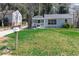 Charming house with manicured lawn, large front window, and a welcoming front porch at 1268 Kenilworth Sw Dr, Atlanta, GA 30310
