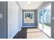 Sunlit sun room with hardwood floors, large windows, and sliding glass door to the backyard at 1268 Kenilworth Sw Dr, Atlanta, GA 30310