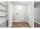 Laundry room with built-in shelving and vinyl flooring at 1870 Oak Valley Rd, Decatur, GA 30035