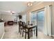 Bright dining area with sliding glass doors leading to the backyard at 2235 Beckenham Pl, Dacula, GA 30019