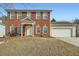 Two-story brick home with attached garage and neat lawn at 2235 Beckenham Pl, Dacula, GA 30019