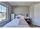 Charming bedroom with a white bed frame and built-in dresser at 4144 Hawking Dr, Suwanee, GA 30024