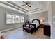 Spacious bedroom with a coffered ceiling, hardwood floors and large windows at 4144 Hawking Dr, Suwanee, GA 30024