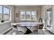 Breakfast nook features an oval wooden table and gray chairs at 4144 Hawking Dr, Suwanee, GA 30024