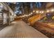 Inviting outdoor space featuring a spacious deck and wooden staircase illuminated by decorative string lights at 2139 Cedarbrook Se Ct, Atlanta, GA 30316
