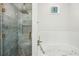 Relaxing soaking tub and separate glass enclosed shower with rainfall showerhead at 2139 Cedarbrook Se Ct, Atlanta, GA 30316