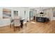 Charming dining area adjacent to a modern kitchen, complemented by hardwood floors and natural light at 2139 Cedarbrook Se Ct, Atlanta, GA 30316