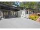 Home with a covered area beside the driveway entrance and a well-maintained garden at 2139 Cedarbrook Se Ct, Atlanta, GA 30316