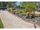 View of the lovely landscaped front yard and driveway of this attractive two-story home at 2139 Cedarbrook Se Ct, Atlanta, GA 30316