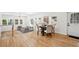 Open-concept living area showcases a dining area and a cozy living space with hardwood floors and ample natural light at 2139 Cedarbrook Se Ct, Atlanta, GA 30316