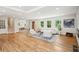Spacious living room features hardwood floors, natural light, and a mirrored wall, creating an open and airy ambiance at 2139 Cedarbrook Se Ct, Atlanta, GA 30316