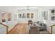 Open-concept living room with hardwood floors, recessed lighting, and abundant natural light from large windows at 2139 Cedarbrook Se Ct, Atlanta, GA 30316