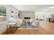Bright living room with a stone fireplace, hardwood floors, and stylish contemporary furnishings at 2139 Cedarbrook Se Ct, Atlanta, GA 30316