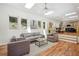 Spacious living room with hardwood floors, skylights, and an open layout flowing into the dining area at 2139 Cedarbrook Se Ct, Atlanta, GA 30316