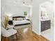 This main bedroom boasts a ceiling fan and view into the en-suite bathroom at 2139 Cedarbrook Se Ct, Atlanta, GA 30316