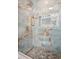 Modern shower with sleek glass doors, unique stone-style tiling, and elegant hardware, creating a spa-like experience at 2139 Cedarbrook Se Ct, Atlanta, GA 30316